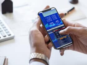 businessman checking stock market online